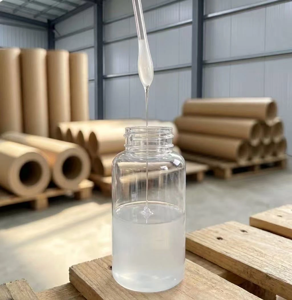 Modified starch adhesive in a glass jar with paper cores stacked behind