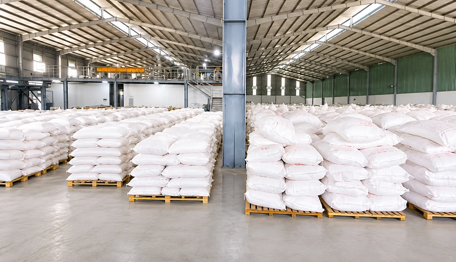 Palletised bags of cassava products in the finished-goods warehouse